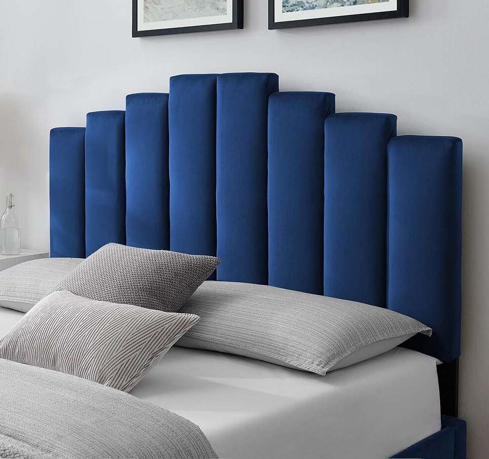 Blue velvet headboard with pillows